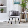 Grey velvet lounge chair, black metal feet, unique back design, suitable for office, living room, bedroom