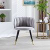 Grey velvet lounge chair, black metal feet, unique back design, suitable for office, living room, bedroom